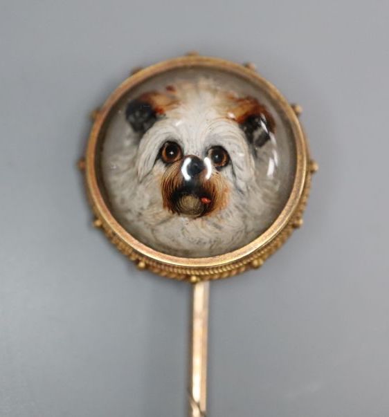 A cased Victorian yellow metal and Essex crystal stick pin, decorated with the head of a dog, 92mm gross 6.2 grams.